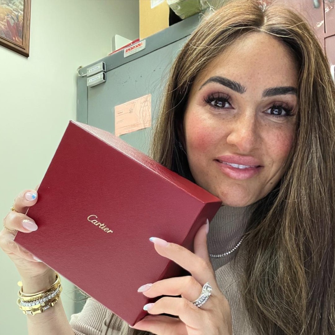 Tami from ID Jewelry In the NYC Diamond District holding a Cartier watch Box